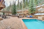 The Timbers outdoor patio with pool, sun deck, hot tubs
